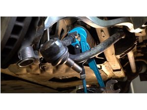 Vissez l'extrémité hors de la barre. Utilisez une clé mixte de No.23 Servez-vous d'une clé ajustable.