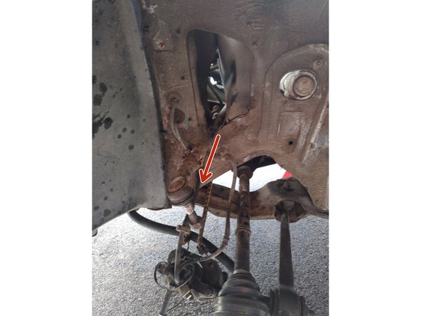 Enlever les deux biellettes depuis le passage de roue