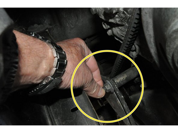 
Remove the nut and remove the tensioner and belt
