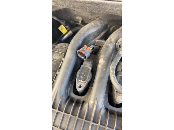 Soulever la languette et pousser vers l'arrière