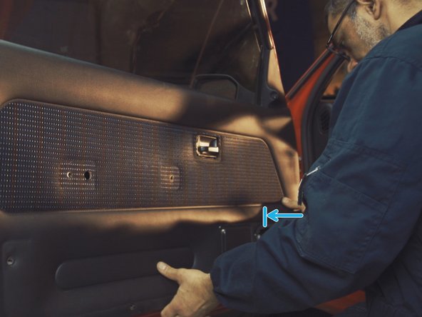 
Press the different parts of the door panel to engage the clips
