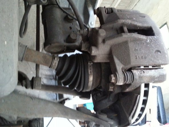 remettre l'étrier de frein et mettre les 2 boulons à l'aide d'une clé de 12 mm