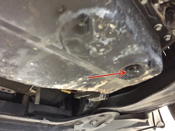 Mettre un bac sous le véhicule