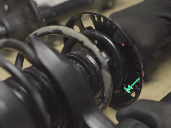 Placer le bout du ressort en buté