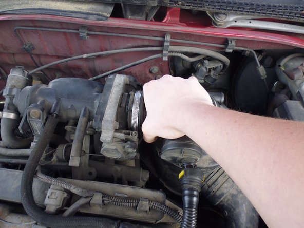 
Once the clamp is loose, pull the hose to the right.
