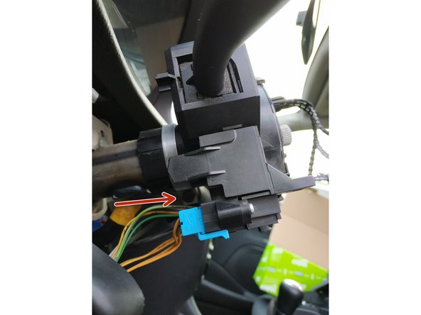 dévisser la vis de maintien du collier métallique du com2000 à l'aide de la clé de 10mm