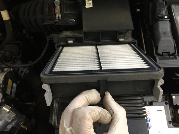
Remove the air filter by pulling towards you
