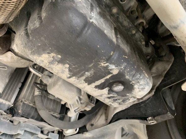 Mettre un bac sous le véhicule