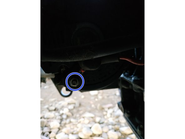 
unscrew the nut of the red wire using the 10mm socket wrench and disconnect it
