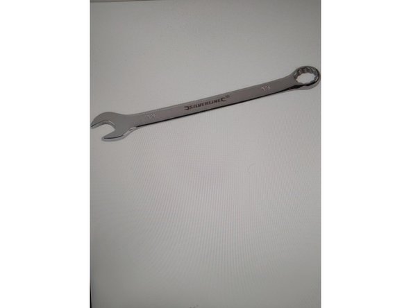 Dévissez l'attache de l'étrier de frein. Utilisez une clé mixte No.13. Utilisez une clé mixte No.15.