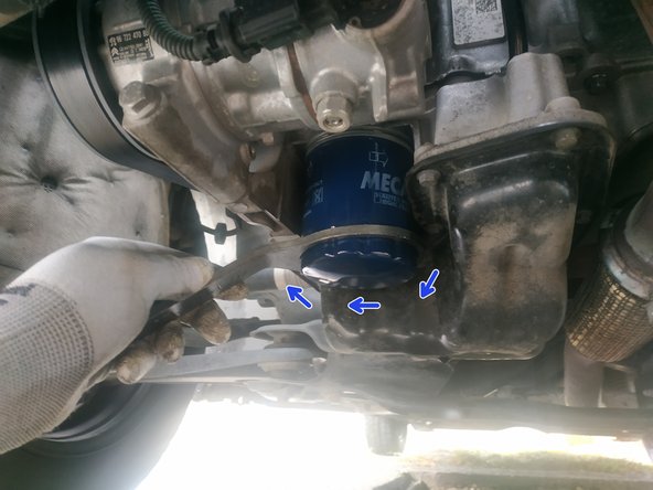 visser le filtre à la main jusqu'au contact