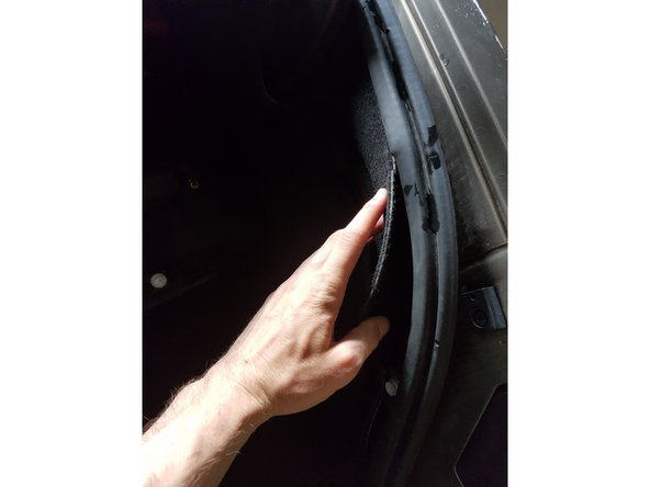 
Lay the carpet inside the trunk seal
