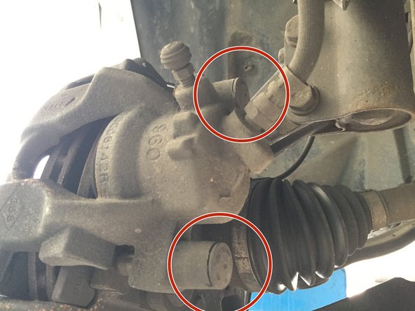 Retirer les deux caches de l'étrier