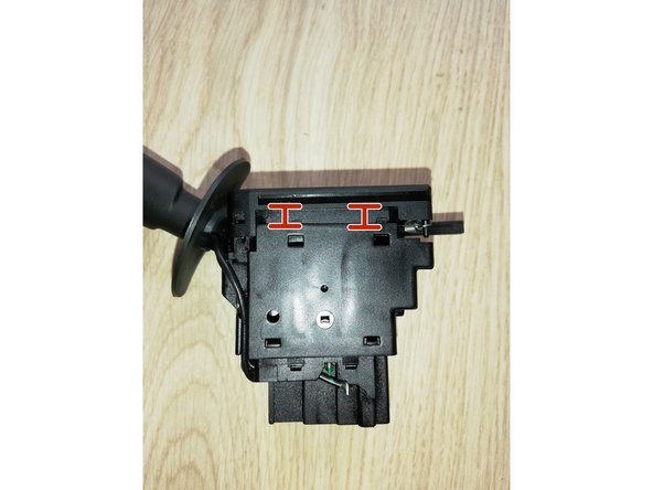 
Locate the various plastic tabs closing the switch. To open the switch, you need to push these tabs using a very thin flat-blade screwdriver.
