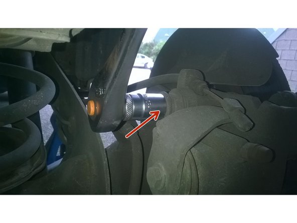 Desserrer le boulon du haut de l'etrier