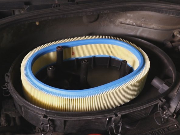 Repositionner le filtre à air dans la boite à air