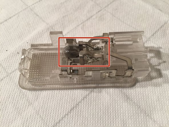 
To remove the electrical connector, press the white tab and pull.
