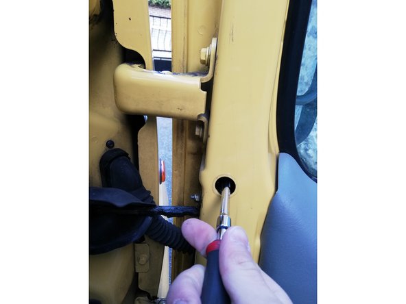 
Be careful not to drop the nut into the door panel
