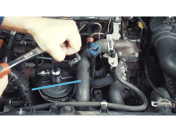 
Keep the cover pressed on the spring then turn about 1/4 turn until it stops.
