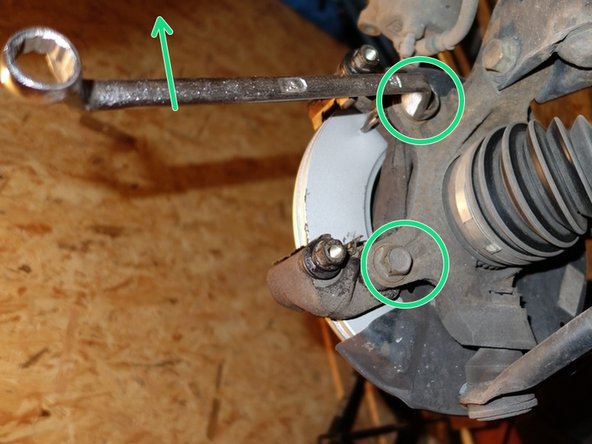 Visser à la main les boulons supérieurs et inférieurs.