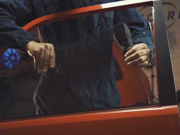 
Remove the window from the top by passing it through the outside of the door
