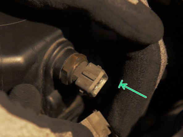 
Reconnect the air temperature sensor connector to the air box cover

