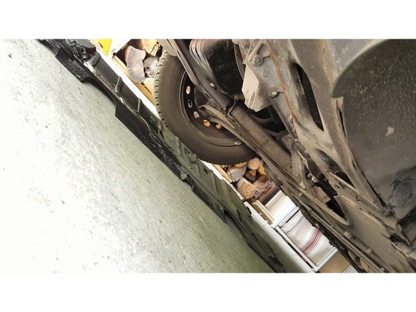 remettre la protection en dessous de la voiture en vérifiant bien qu'il n'y ai pas de fuite au niveau du bouchon