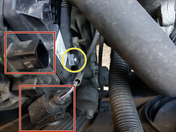 Retirez l'écrou avec une douille de 13mm puis le câble.