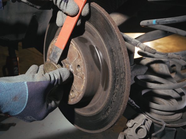 Retirer le cache d'axe