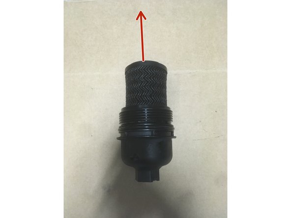 Retirer la cartouche du filtre à huile en la tirant vers le haut