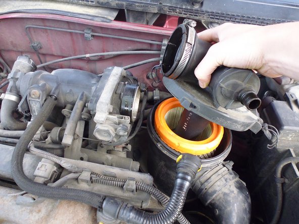 
Once the clips are lifted, turn the cover counterclockwise to unclip it.
