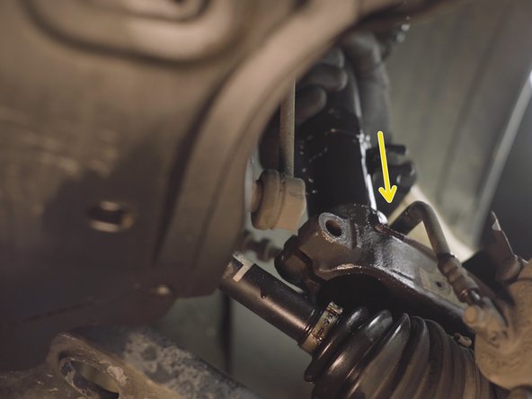 Placer l'amortisseur dans son emplacement