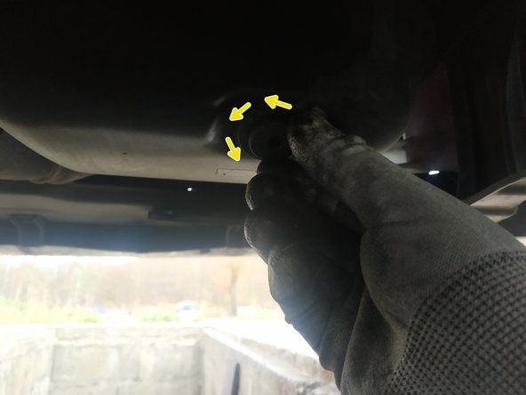 Le bouchon se trouve à l'arrière du carter.