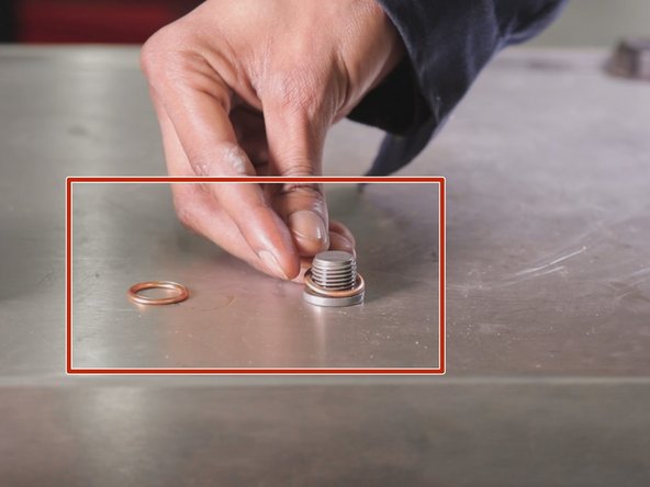 Repositionner le nouveau joint sur le bouchon du carter