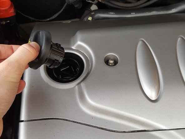 
Unscrew and remove the oil filler cap
