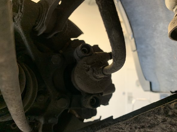 Retirer les deux caches de l'étrier