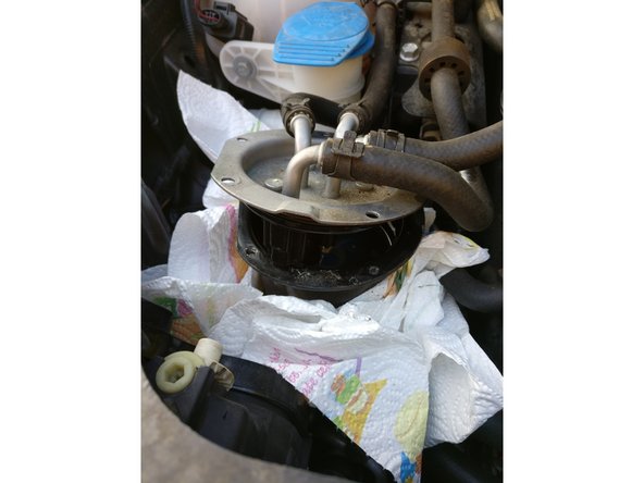 
Using a flat screwdriver, lever the cover off.
