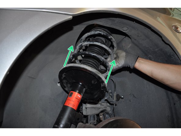 Reposer le nouvel amortisseur et placer le patin plus l'écrou par dessus pour le maintenir en place.