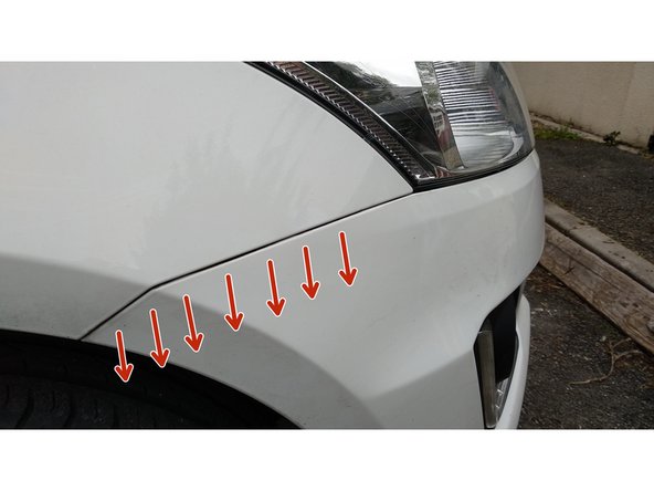 
Once the screws have been removed at the wheel arch, simply unclip the front bumper at the wings.
