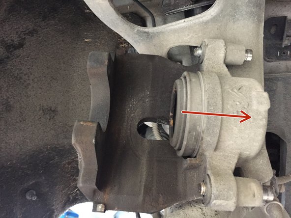 
Using a pair of pliers, push the piston back
