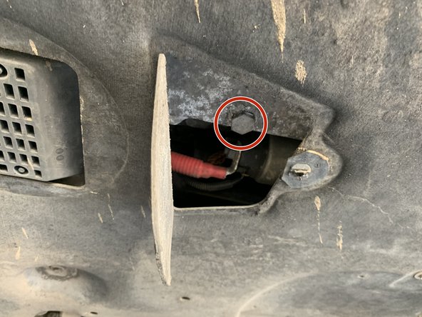 Mettre un bac sous le véhicule