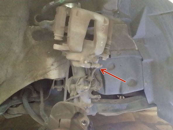 Defaire la fixation du flexible de frein, à l'aide d'un fil de fer accrocher l’étrier afin de le soulager