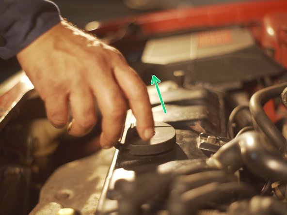 
Remove the engine oil filler cap
