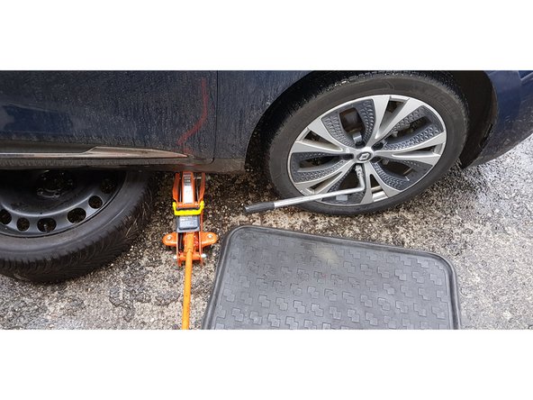 Retirer chandelle, pneu de la mise en sécurité du véhicule.