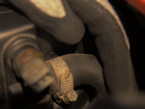 
Tighten the hose clamp with a flat screwdriver
