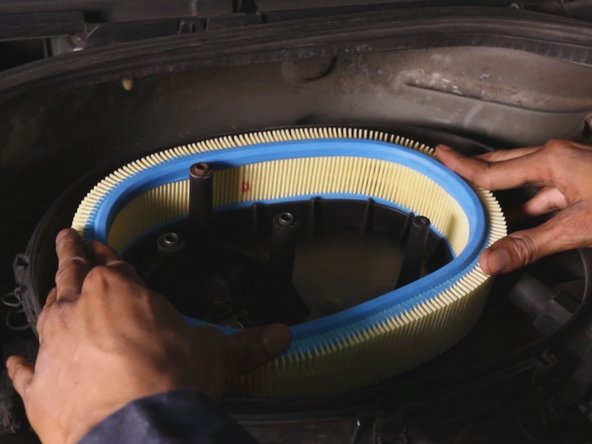 Repositionner le filtre à air dans la boite à air