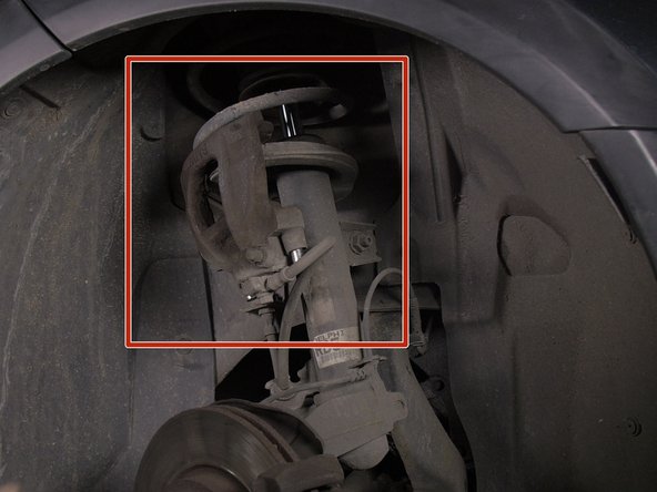 Suspendre l'étrier sur le ressort pour ne pas abîmer le flexible de frein