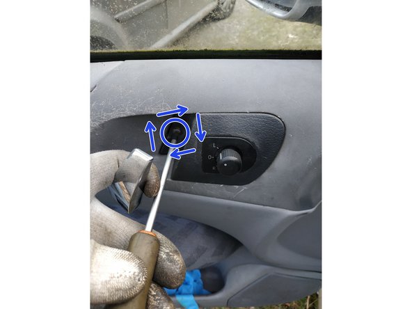 remettre la commande de rétroviseur en place et visser sa vis de maintien à l'aide du tournevis cruciforme