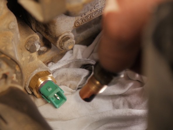 
Replace the new probe in its location and screw it back in by hand.
