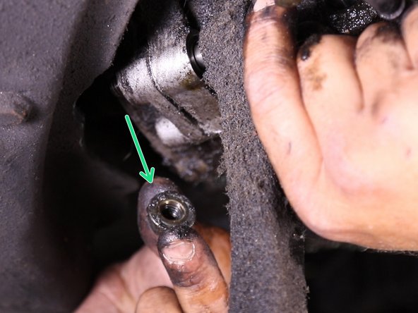 Retirer l'écrou puis la vis placé à l'avant du support